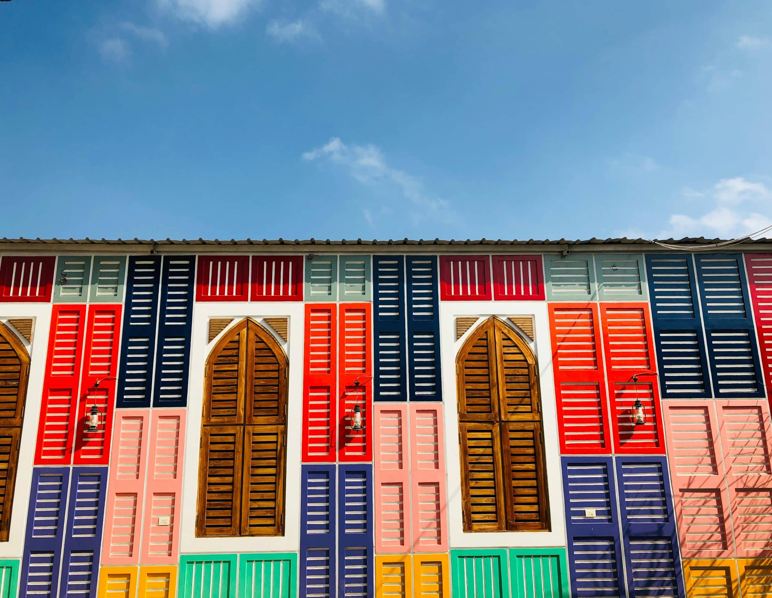 Multicolored wall with wooden doors