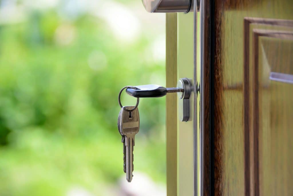 Key inside open door, showing outdoors